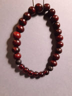 CHAKRA BRACCIALE LEGNO: n°1 MULADHARA GRANATO